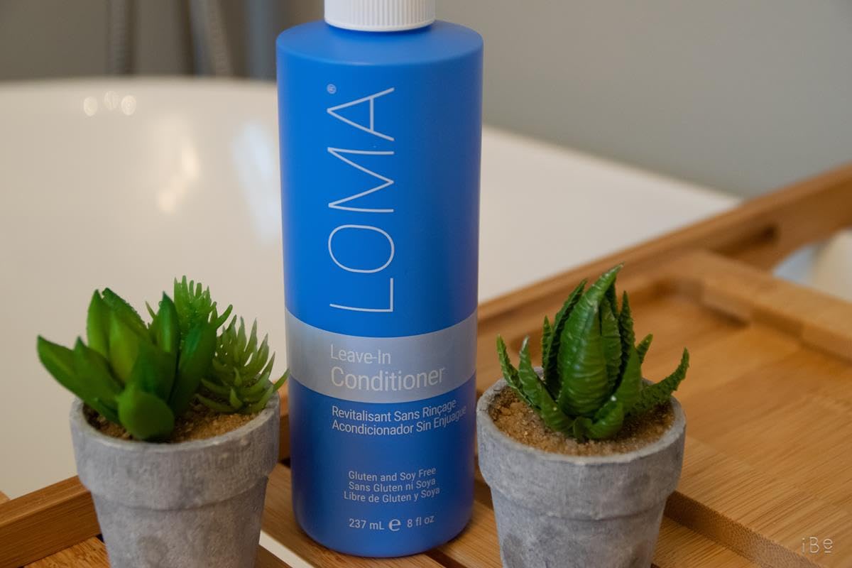 Loma leave-in conditioner spray in action for easy application and quick detangling.