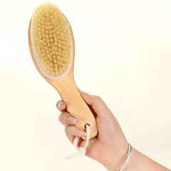 LONGCO contoured handle usage on legs and arms for better control during dry brushing routine.