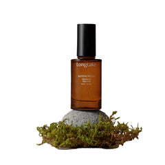 LONGTAKE Sandalwood Hair Oil bottle showcases glossy, lightweight shine.