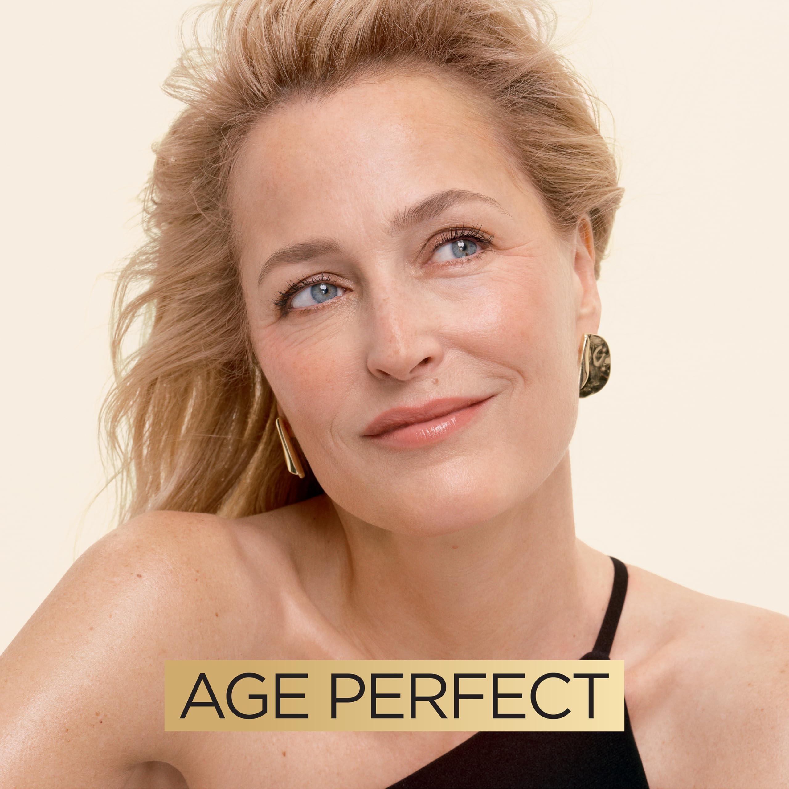 Night-time routine setup featuring L'Oreal Paris Age Perfect moisturizer as part of a bedtime regimen.