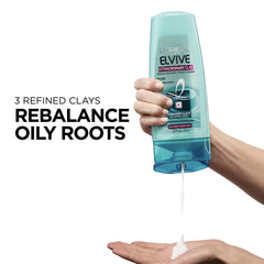 L'Oréal Paris Elvive Extraordinary Clay conditioner closeup dispenses product for root purification.