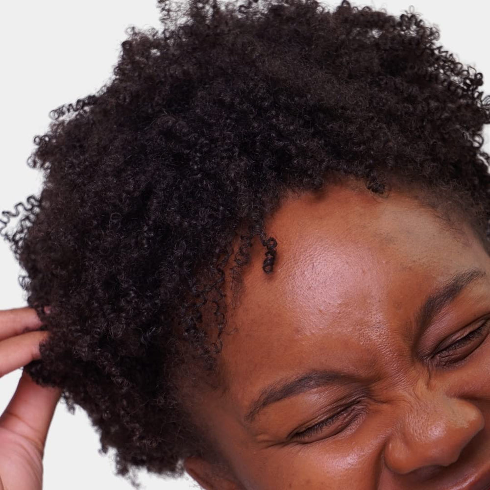 Portrait of defined kinky-coily curls using Love Ur Curls cream