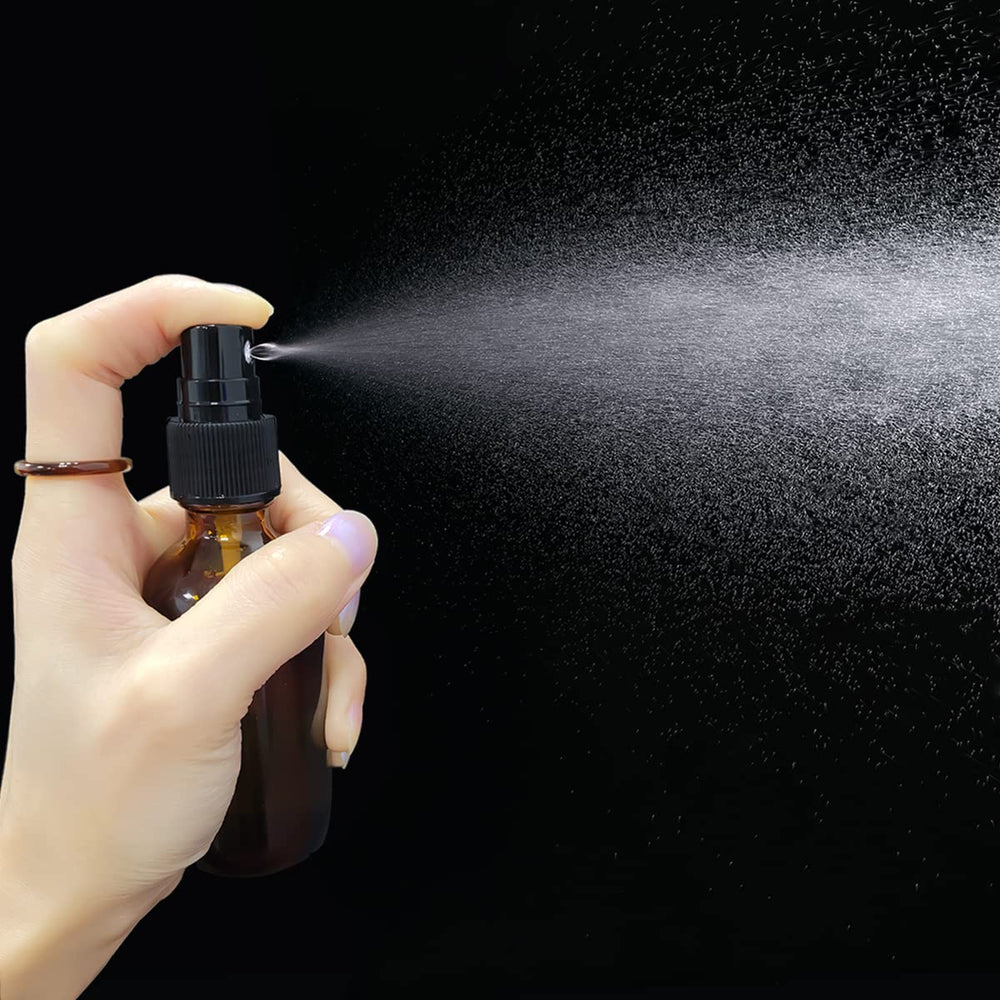 LUFEVRM black mist sprayer on amber bottle delivers fine mist for scents.
