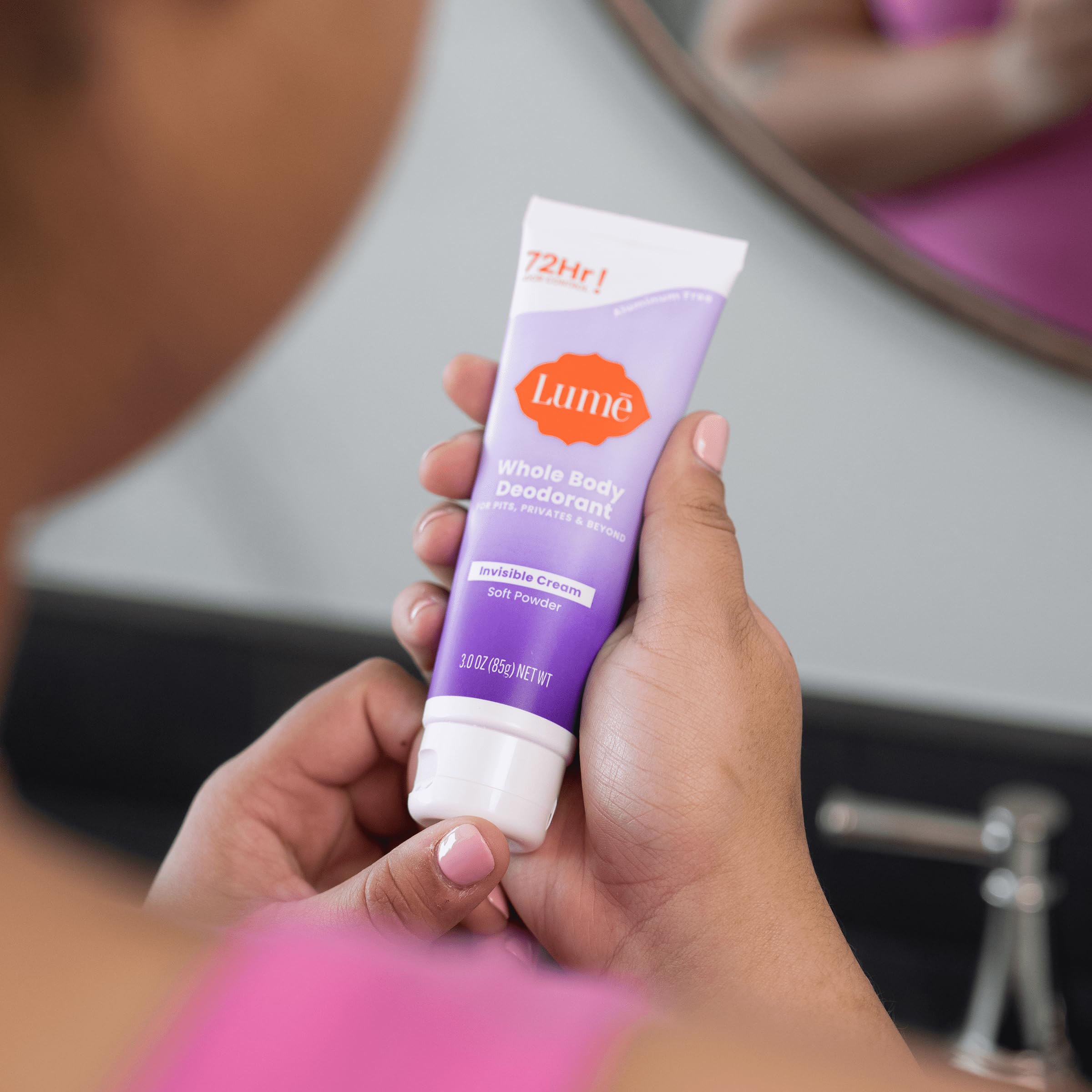 Lume hand dispensing the invisible cream for easy everyday use.