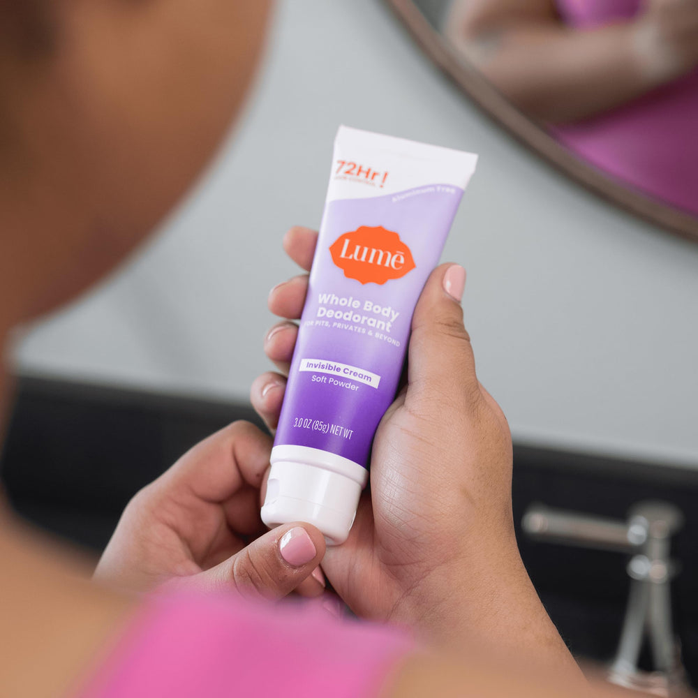 Lume hand dispensing the invisible cream for easy everyday use.