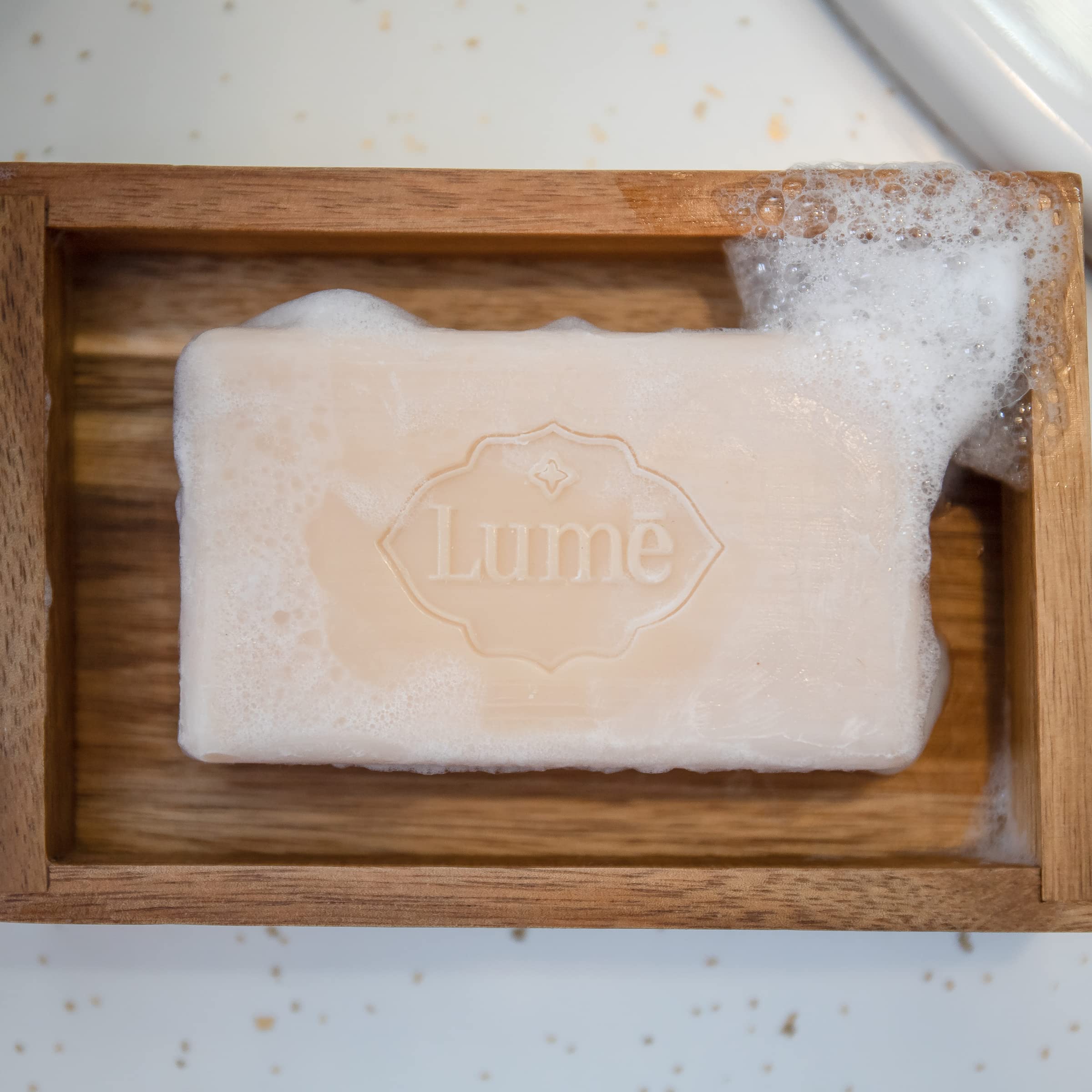 Lume triple-milled bar soap clean-tangerine-scent close-up capturing bright citrus fragrance