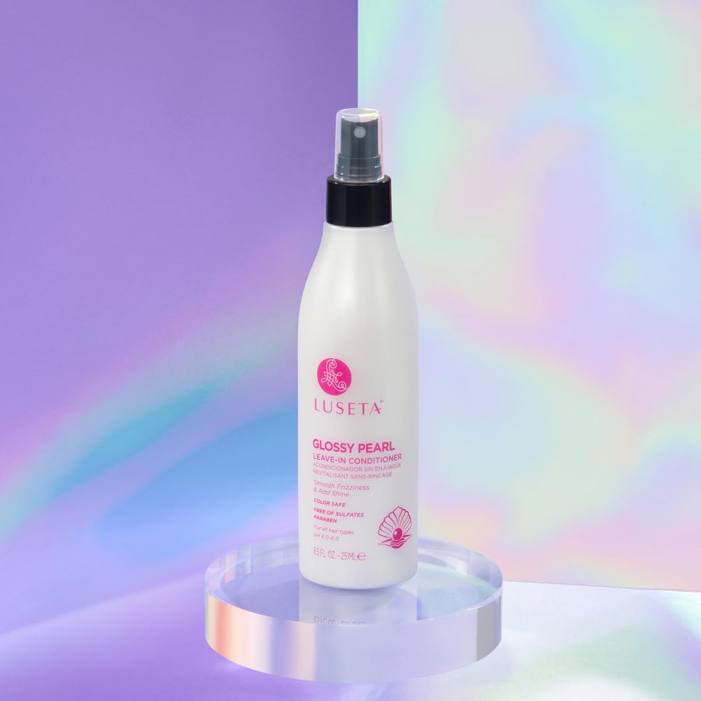 Luseta Glossy Pearl Leave-In Conditioner on silky hair for smoother styling.