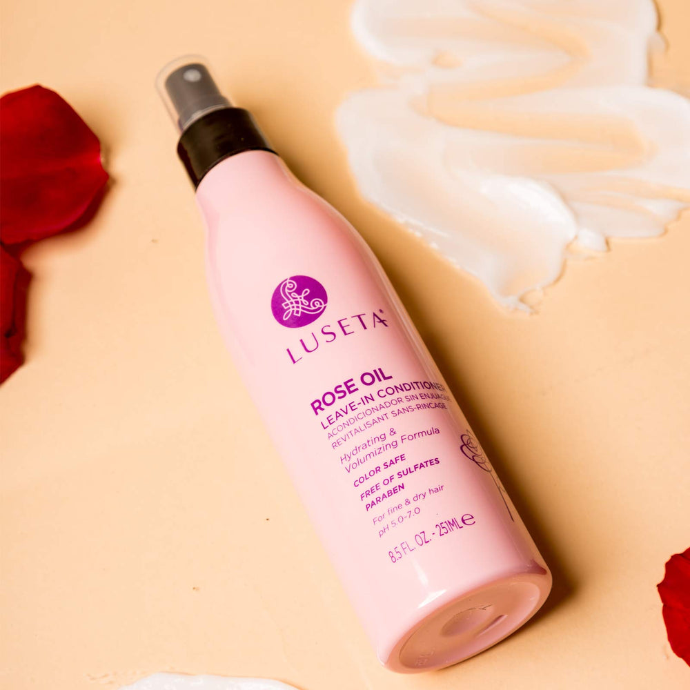 Luseta rose oil leave-in conditioner dispensing spray shown for easy application