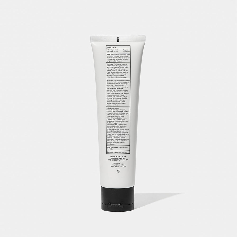 Mad Rabbit Defend Tattoo Sunscreen packaging box emphasizes travel-friendly 100 mL size
