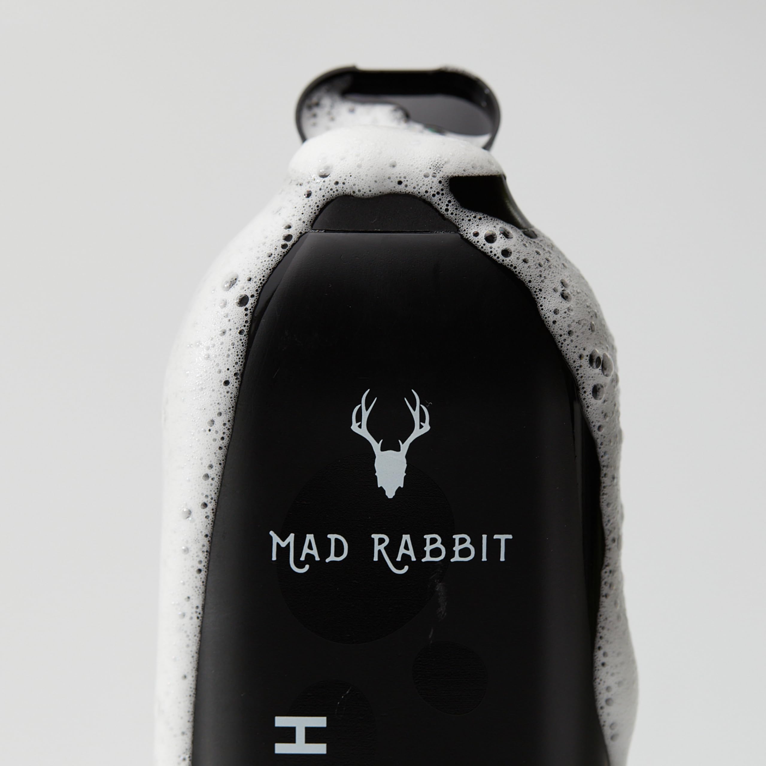 Mad Rabbit Refresh Body Wash tattoo care scene conveys suitability for existing tattoos.