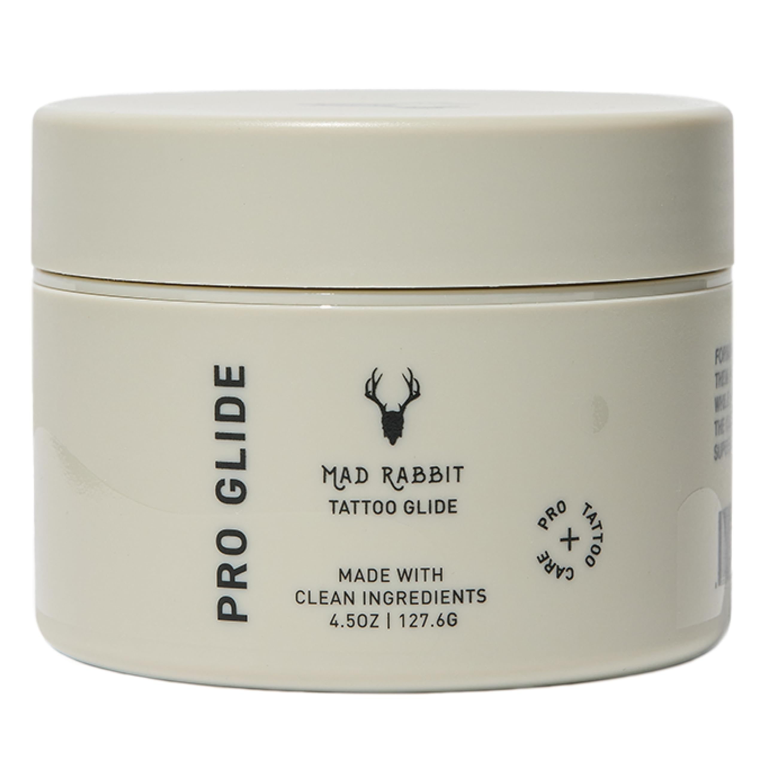 Mad Rabbit Tattoo Artist Glide bottle on a clean studio station for smooth tattooing and skin protection.