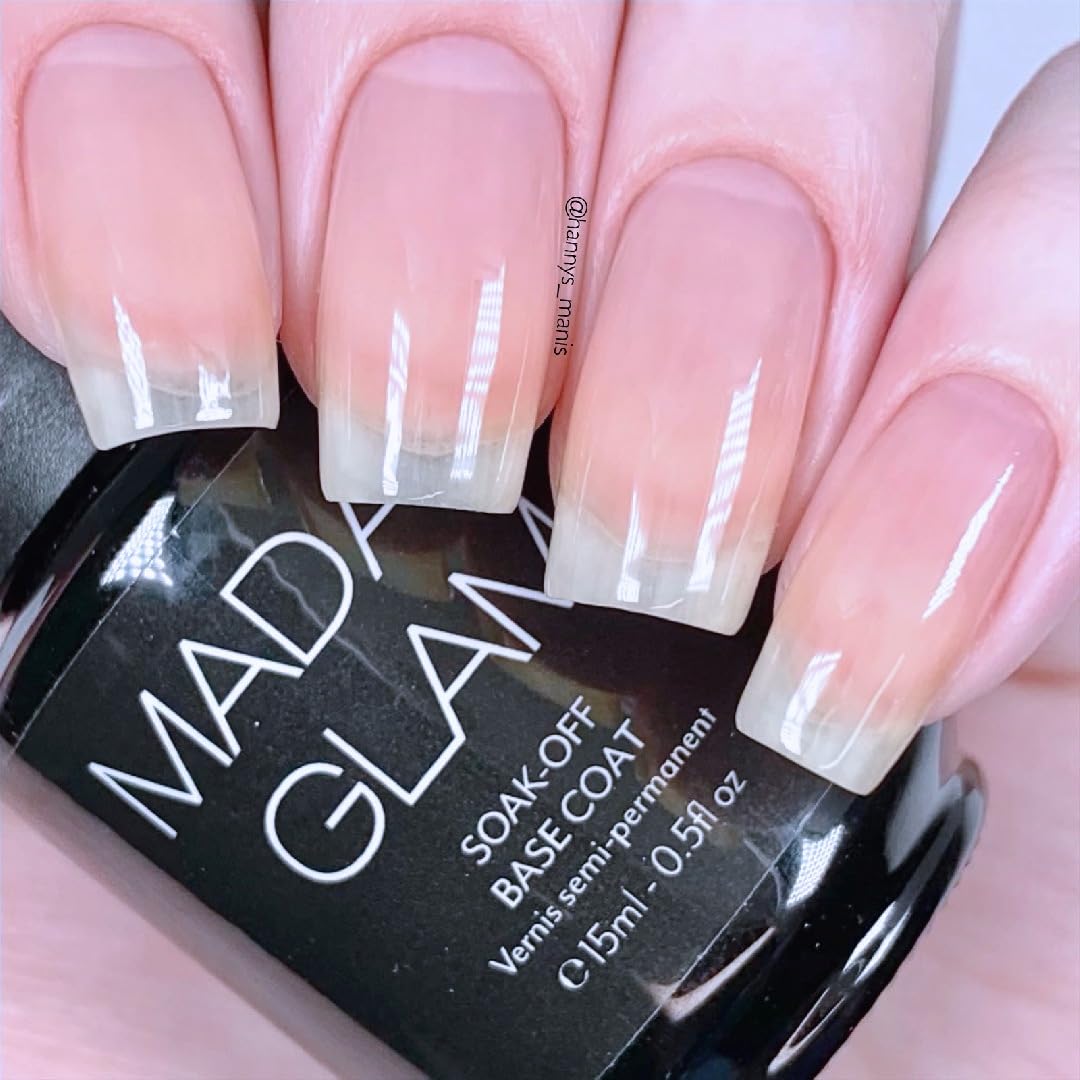 Madam Glam Rubber Base bottle under lamp demonstrates long-wear base for thin nails.