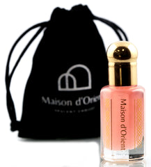 Maison d'Orient Pink Musk bottle closeup, portable luxury for travel and daily wear
