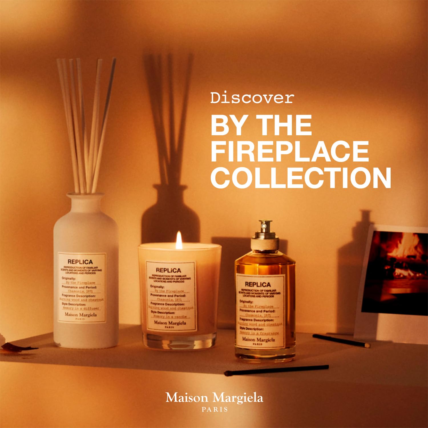 Snowy window backdrop contrasts with Maison Margiela Replica By the Fireplace for cozy winter moments.