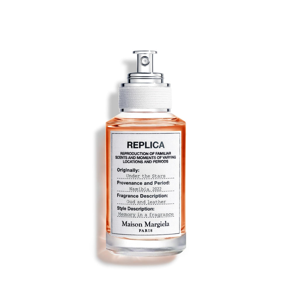 Maison Margiela Replica Under the Stars bottle closeup for a warm, lingering evening aura.