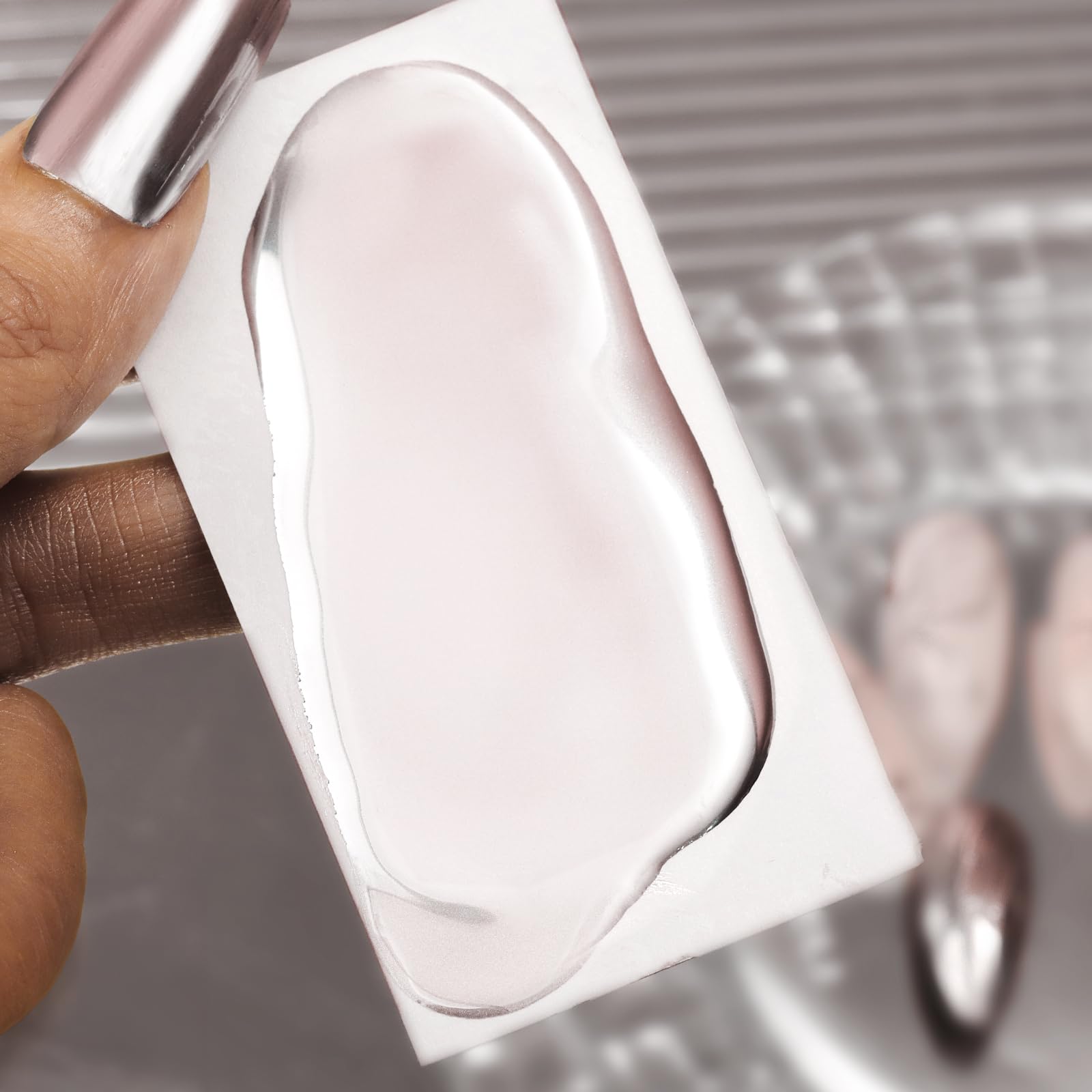 Makartt Rose Gold Chrome Nail Shine demonstrates long lasting mirror effect under light.