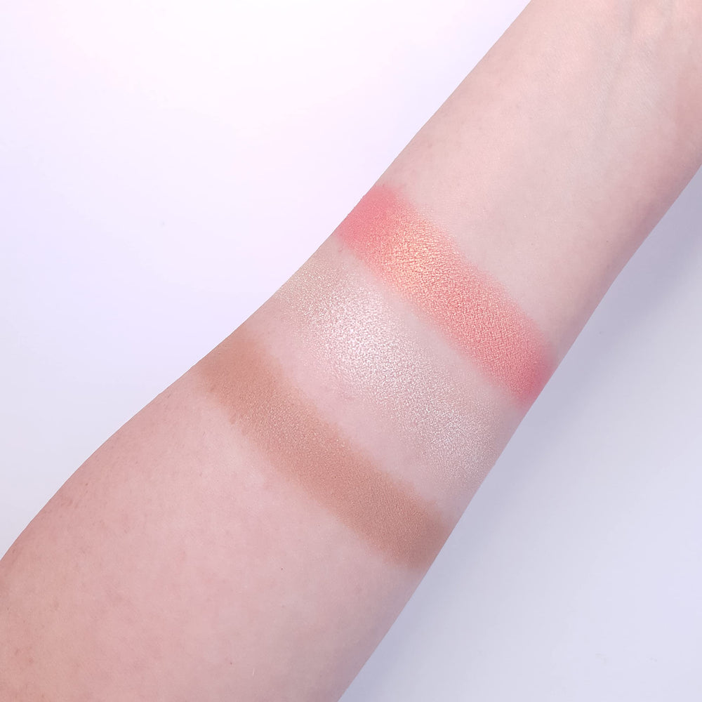 Makeup Revolution highlighter powder catches light for lifted cheekbones.