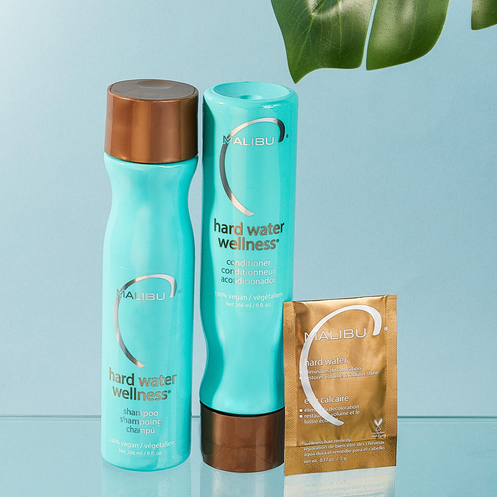 Malibu C conditioner application on hair mid-lengths to ends for shine.