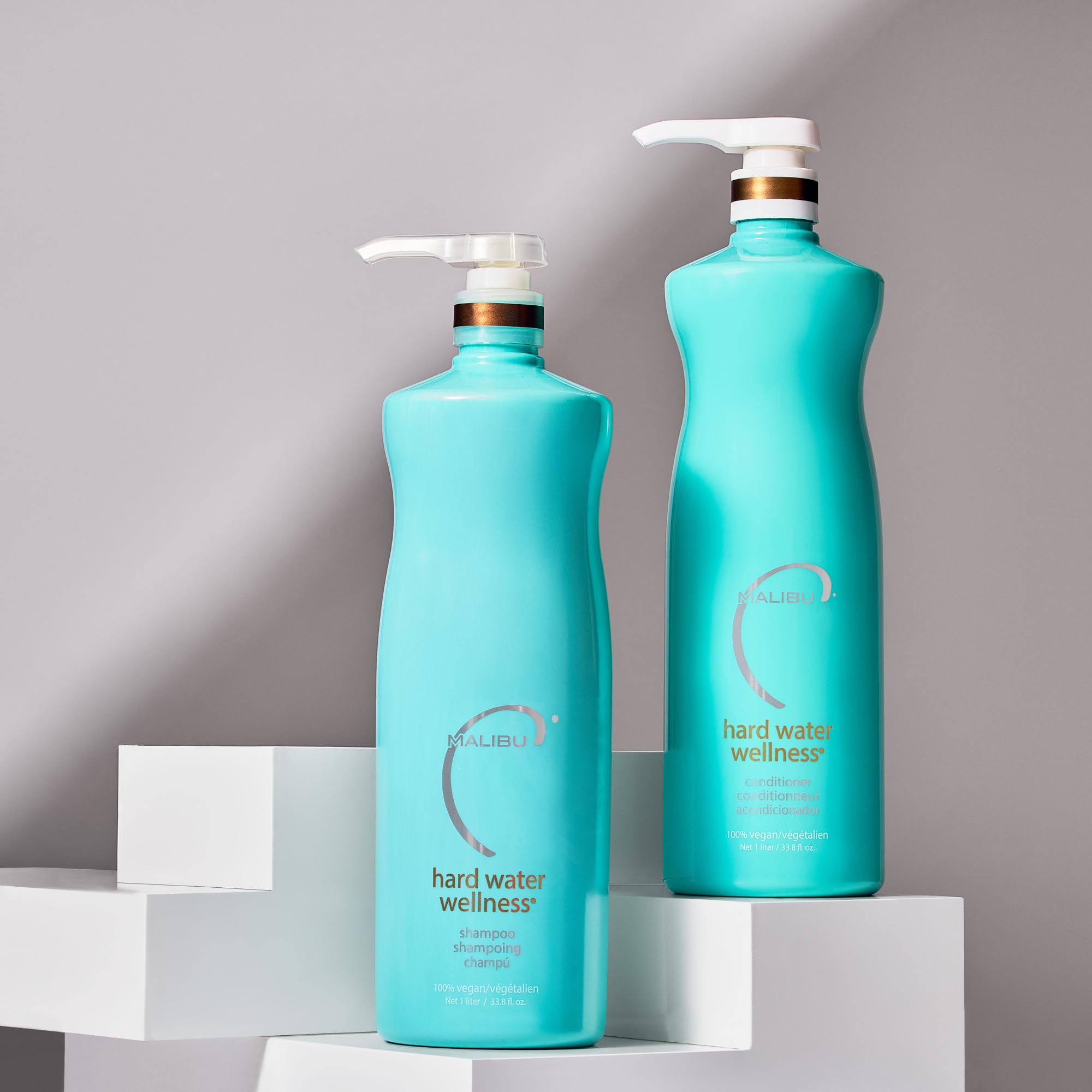 Malibu C Hard Water Wellness Conditioner label closeup emphasizes vegan, cruelty-free formula.