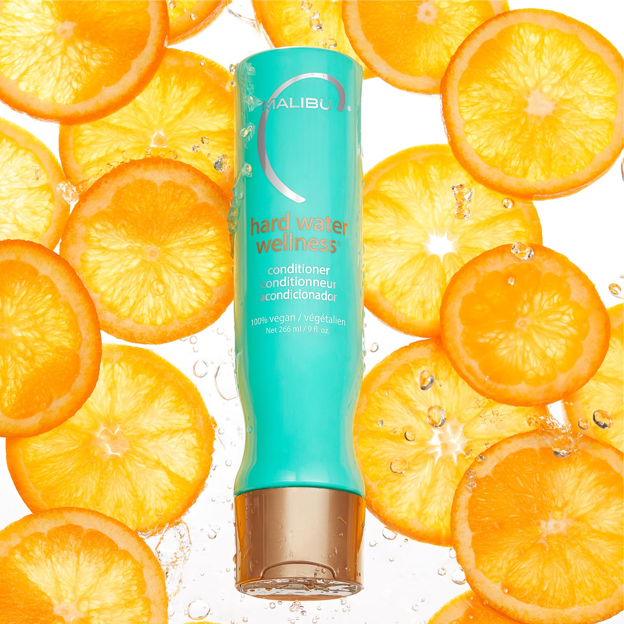 Malibu C conditioner pour scene demonstrates easy detangling and even distribution.