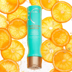 Malibu C conditioner pour scene demonstrates easy detangling and even distribution.