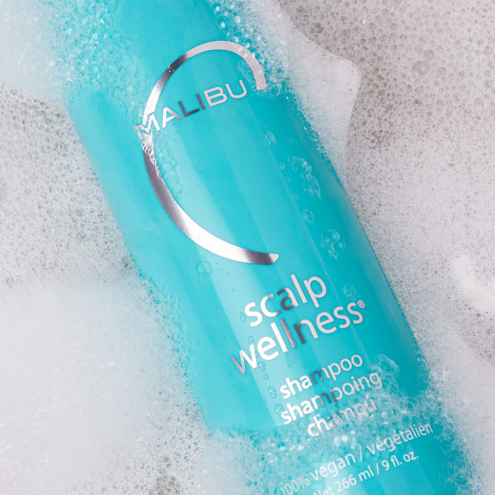 Malibu C Scalp Wellness Shampoo water-droplets capture a hydrating wash moment.