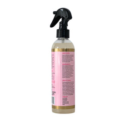 The Mane Attraction Nourishing Daily Hair Growth Moisture Mist application demonstrates easy no-rinse scalp spray.