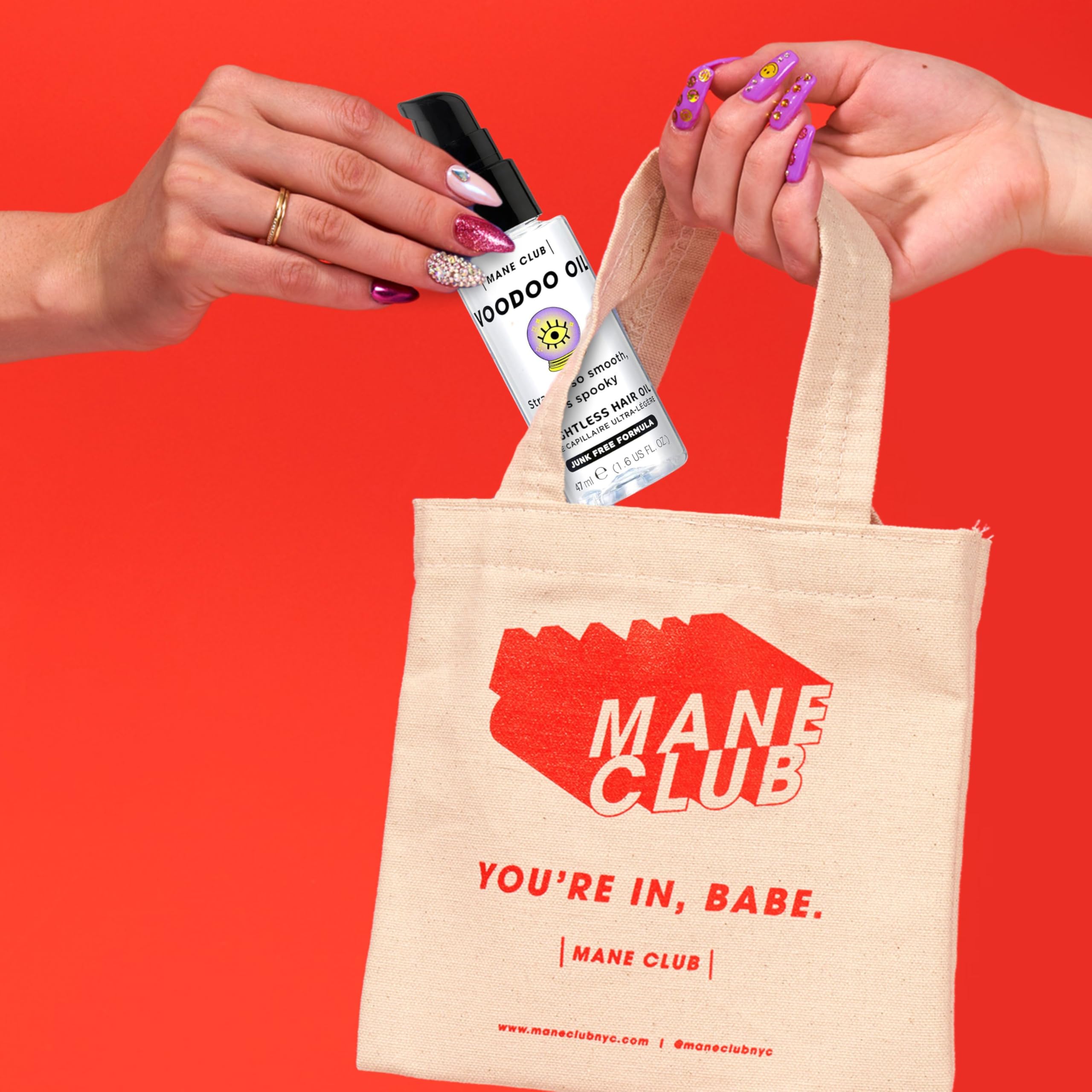 MANE CLUB VOODOO OIL bottle pour demonstrates weightless shine for all hair types