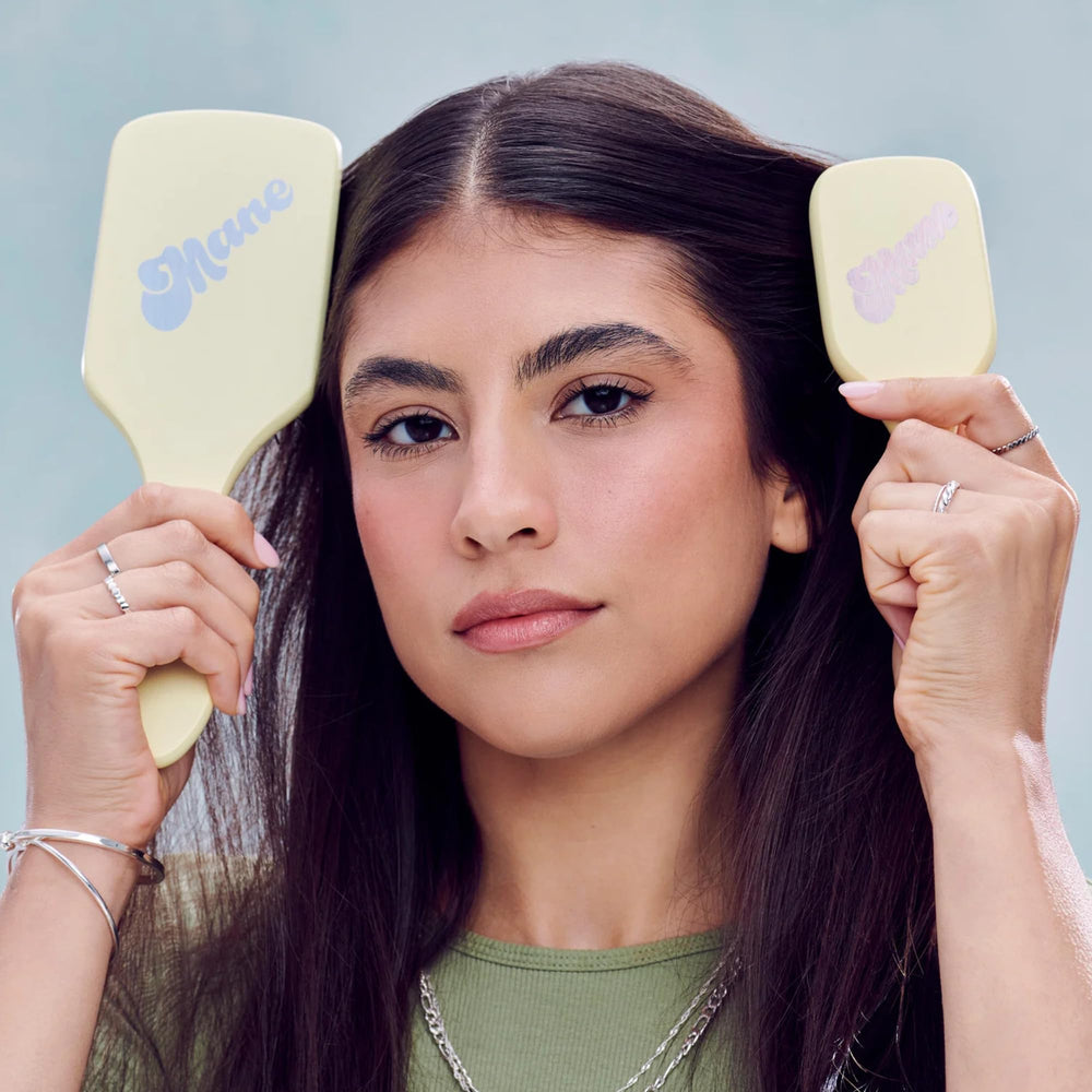 Mane Ready or Knot Mini Detangler Brush used on damp hair, detangles with minimal breakage.