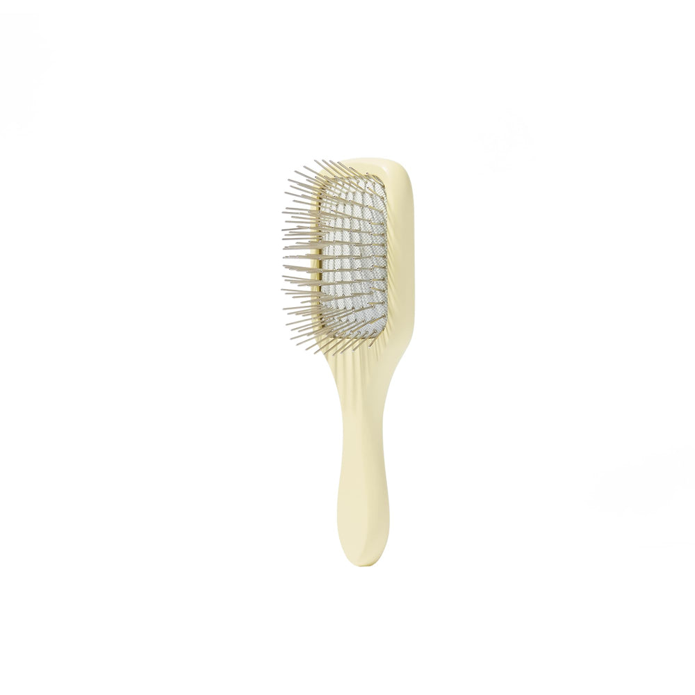 Mane Ready or Knot Mini Detangler Brush metal bristles close-up, promotes oil distribution.
