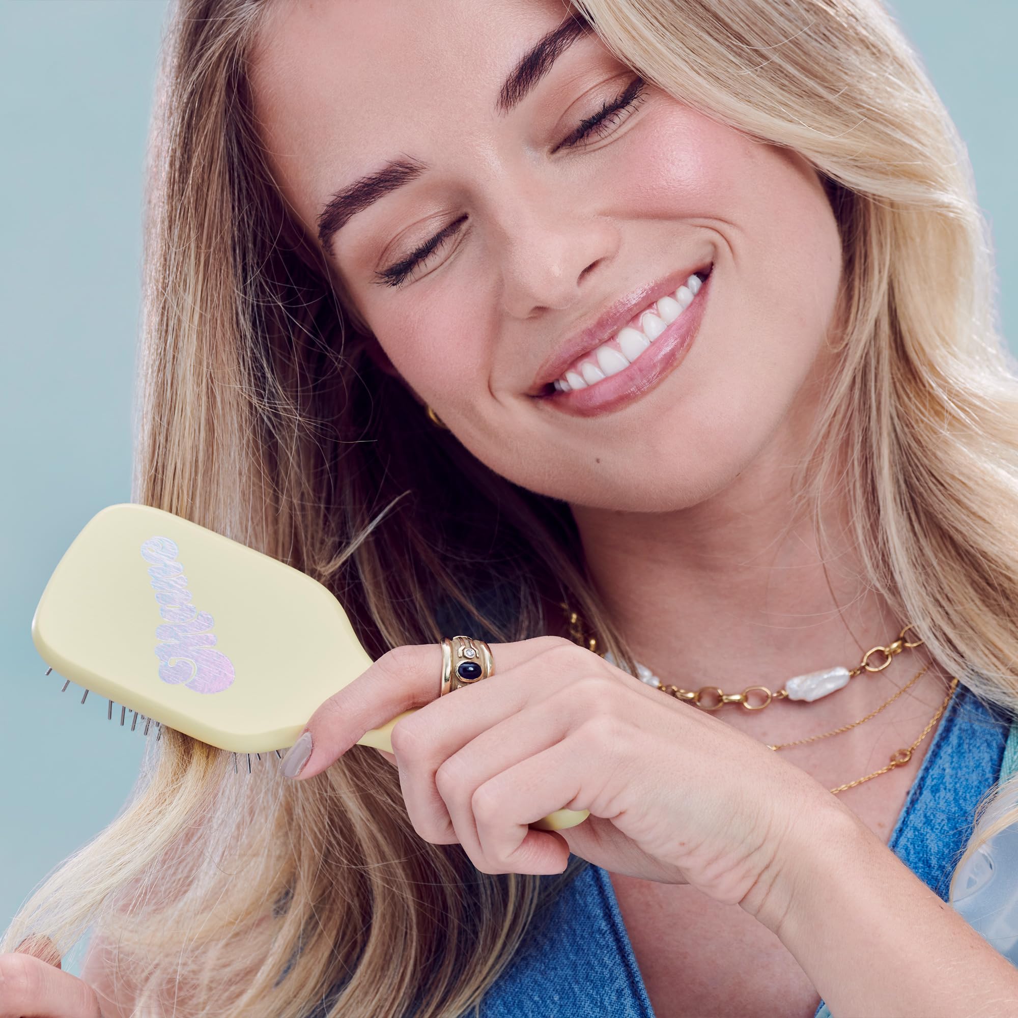 Mane Ready or Knot Mini Detangler Brush packaging, compact for travel and on-the-go styling.