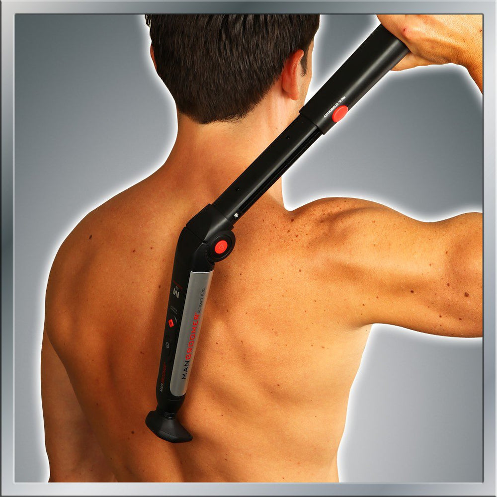 MANGROOMER Ultimate Pro Back Shaver extended rubberized handle in use for reach.