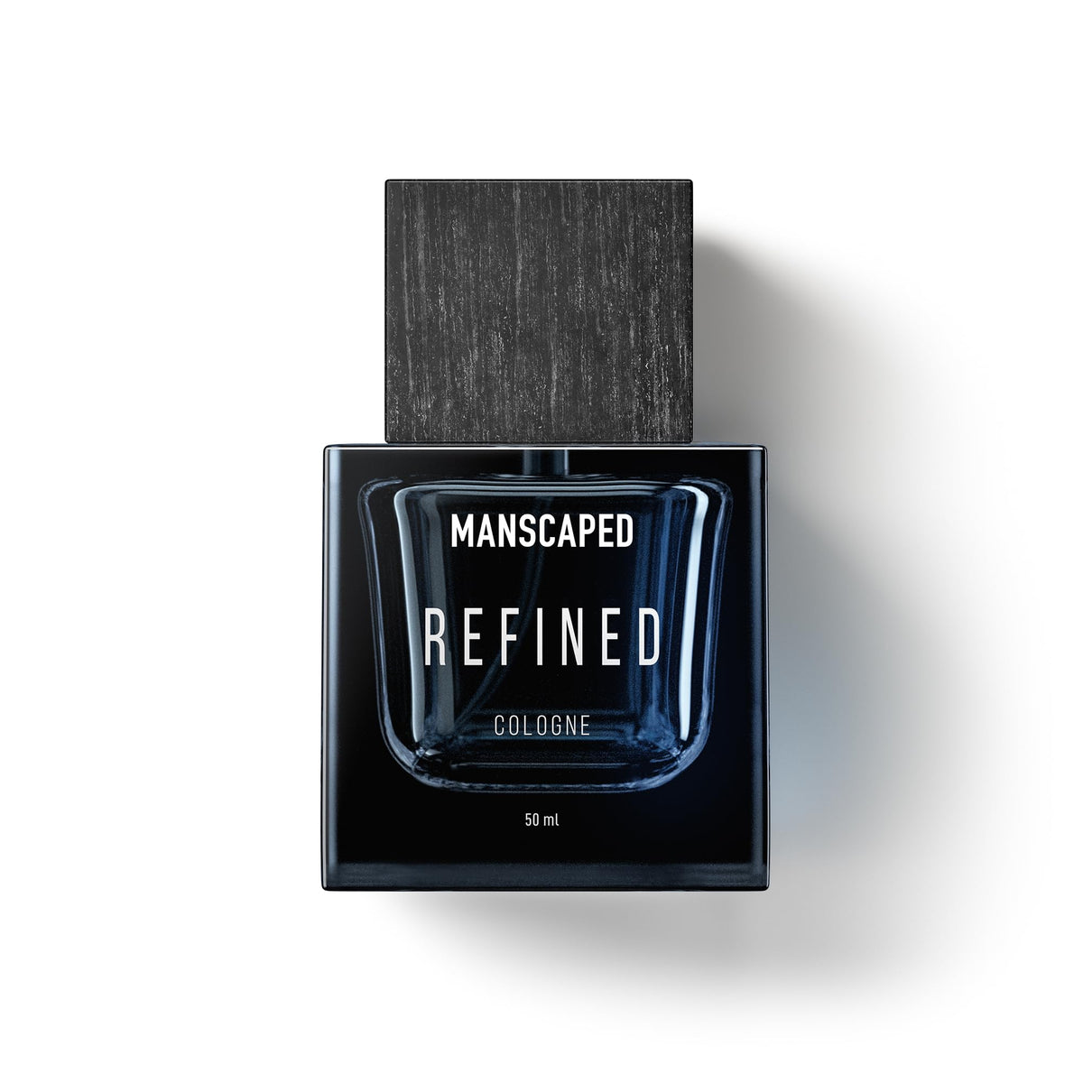 MANSCAPED Refined Cologne bottle cap showcases premium wood finish for a refined dresser look