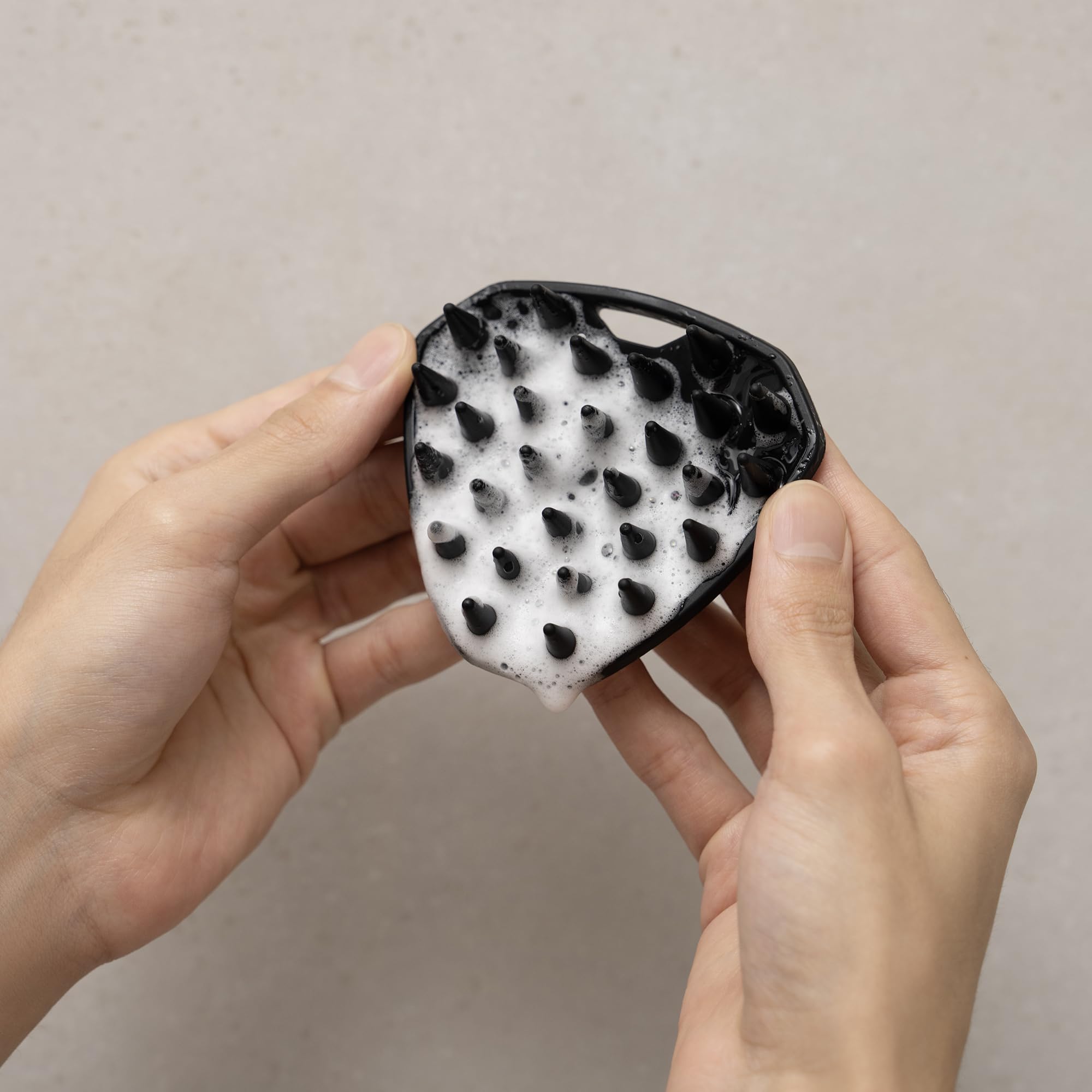 MANSCAPED Scalp Buffer compact design ideal for travel and gym bags.