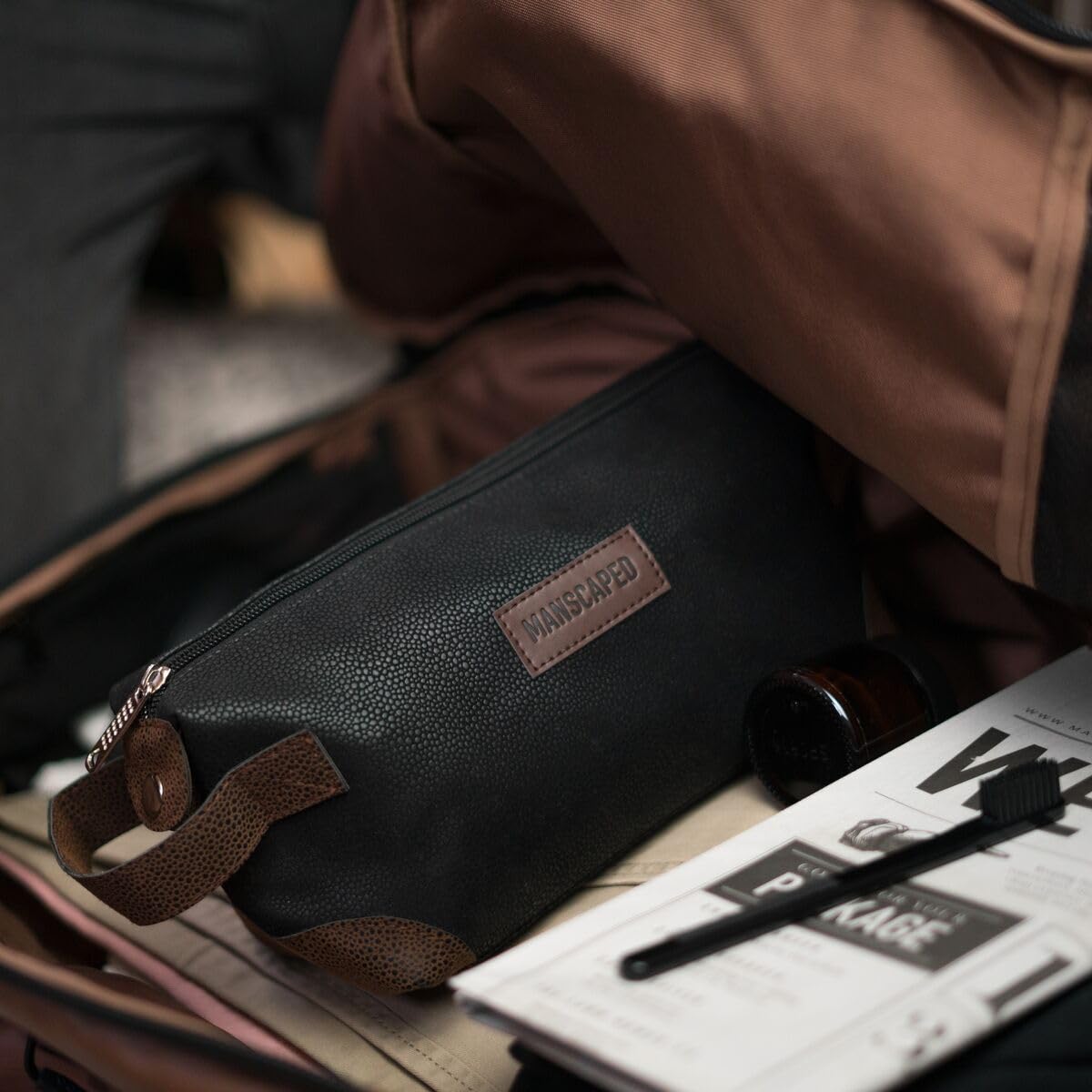 MANSCAPED The Shed water-resistant PU leather withstands daily travel.