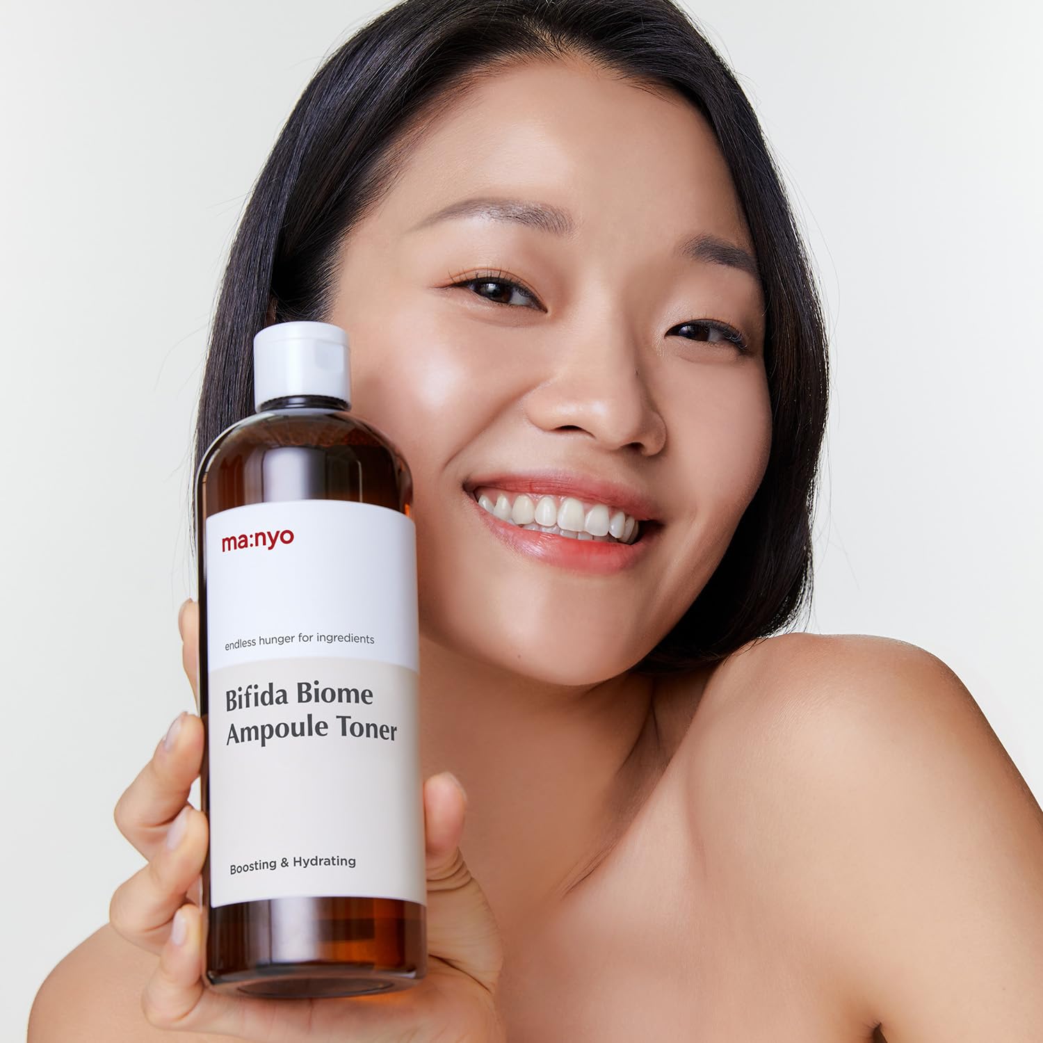 Manyo Bifida Biome Ampoule Toner bottle pour demonstrates controlled, easy application