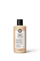 Maria Nila Head & Hair Heal bottle pour demonstrates easy application for even distribution