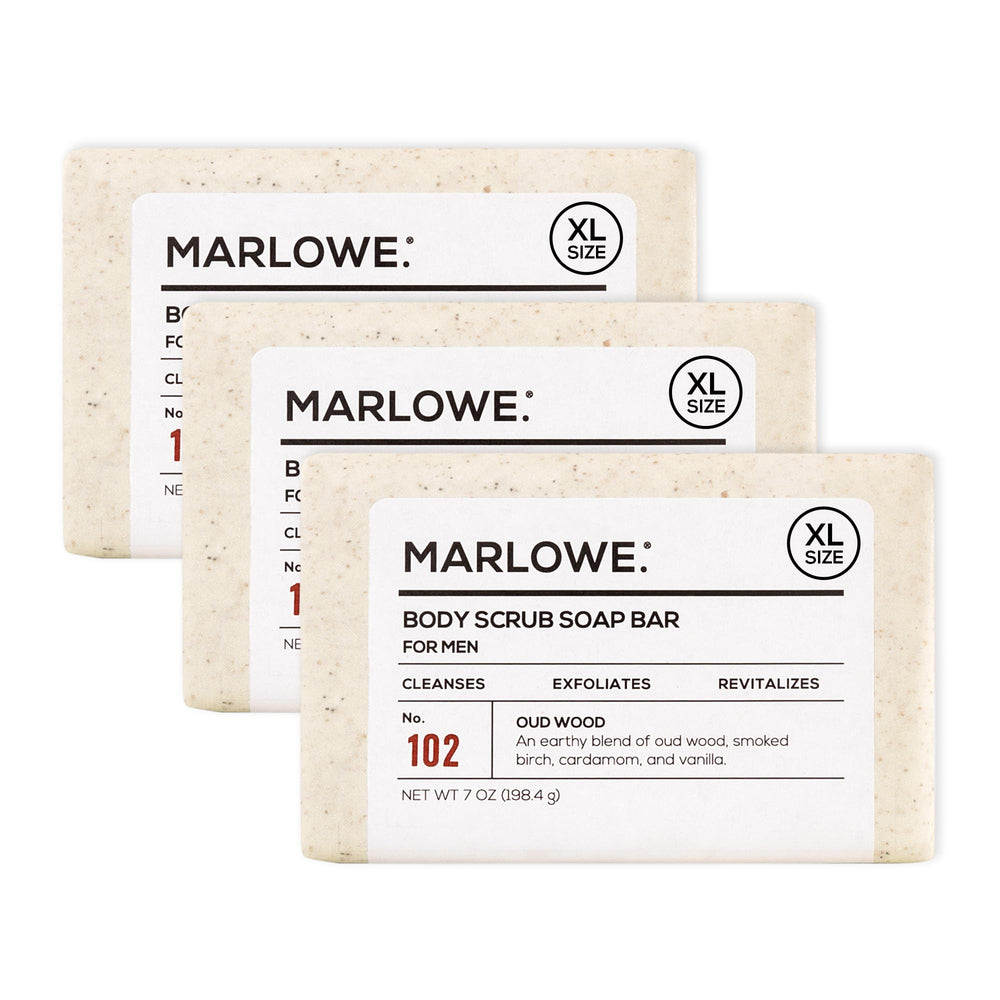 MARLOWE No. 102 Oud Wood scrub bar close-up showing gritty exfoliation for smoother skin.