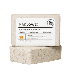 MARLOWE No. 102 Santal exfoliating bar close-up highlights gritty texture for smoother skin.