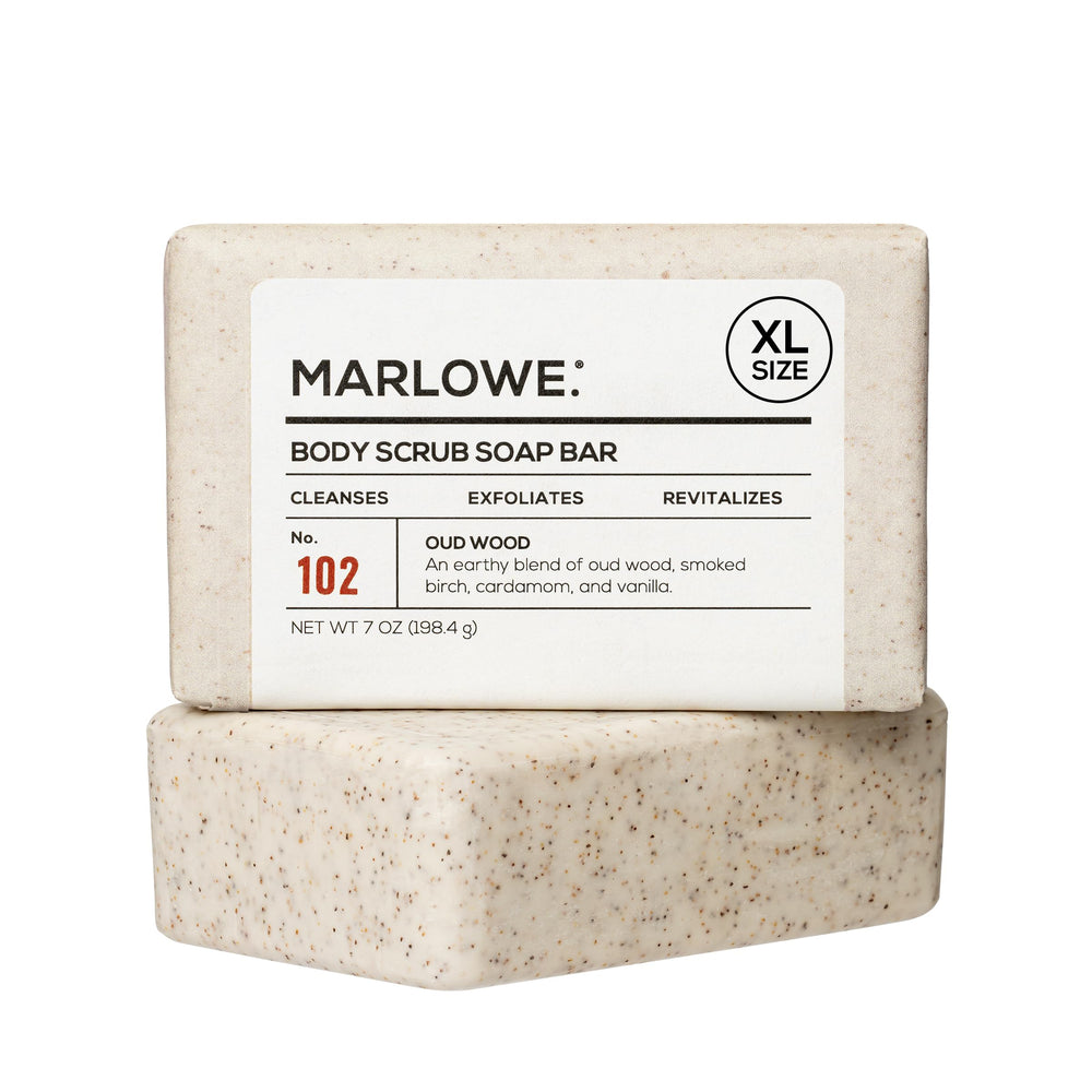 MARLOWE No.102 Oud Wood body scrub close-up showing pumice exfoliation for smoother skin