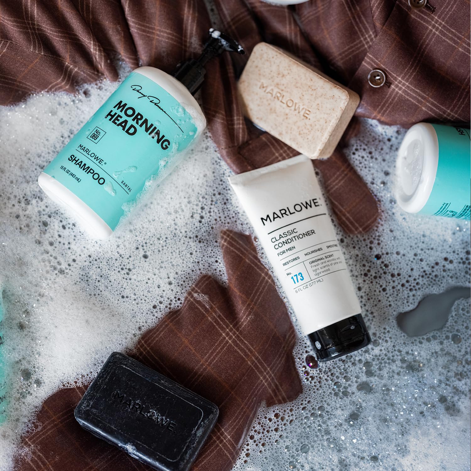 Marlowe No.106 Charcoal Cleanser bottle with slate background suggesting deep cleansing.