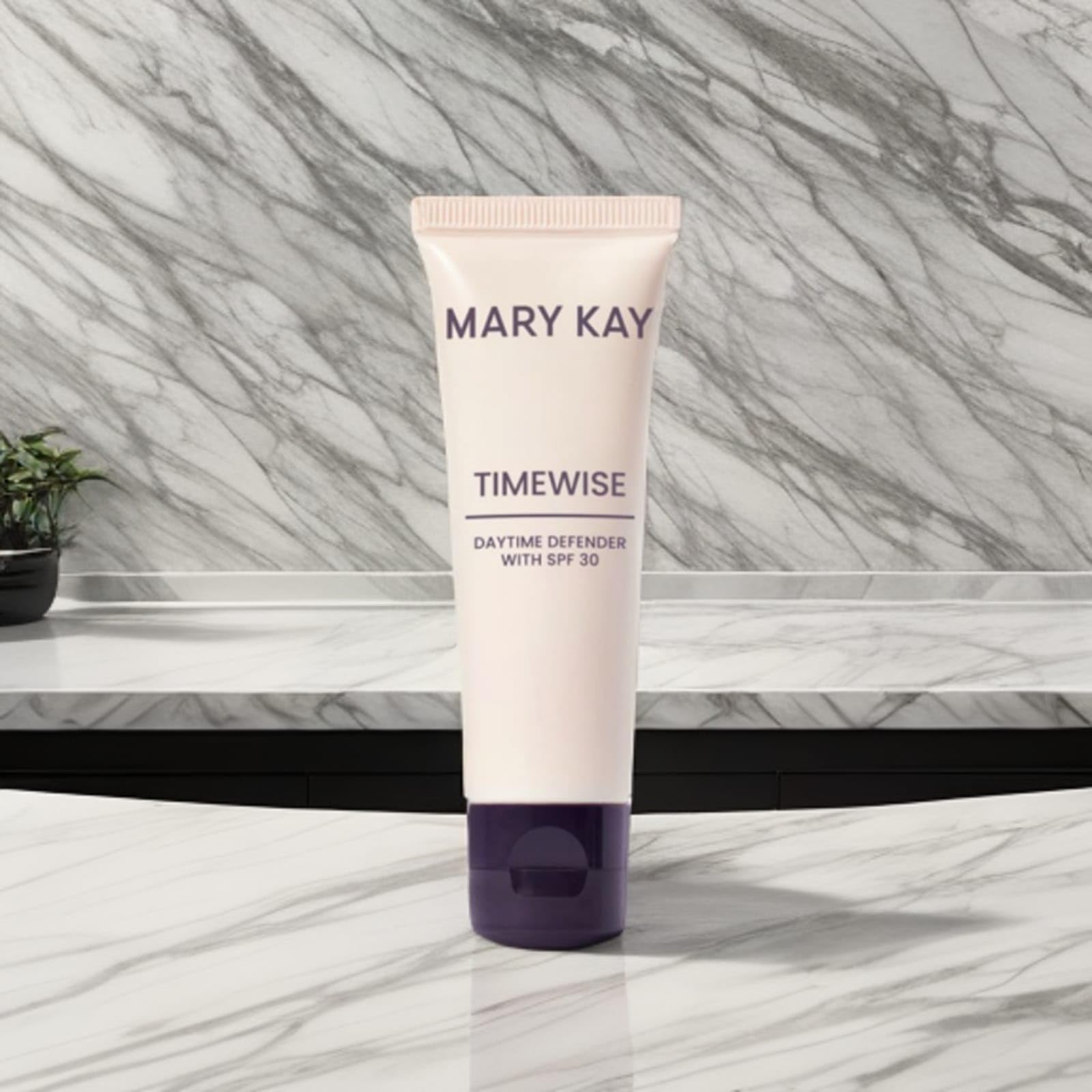 Mary Kay Timewise Daytime protective facial lotion jar on a bathroom sink, daily protection.