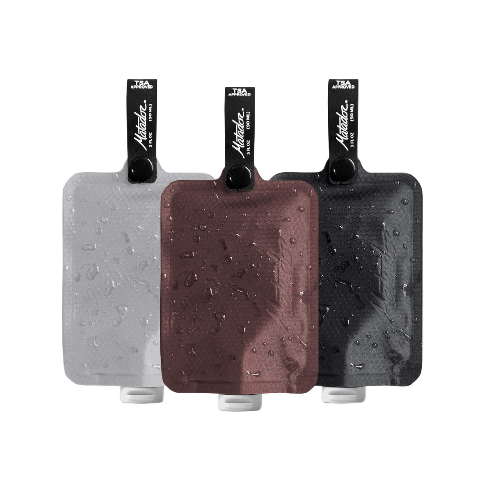 Matador FlatPak three-pack assembled shows compact bottles for minimalist travel kits.