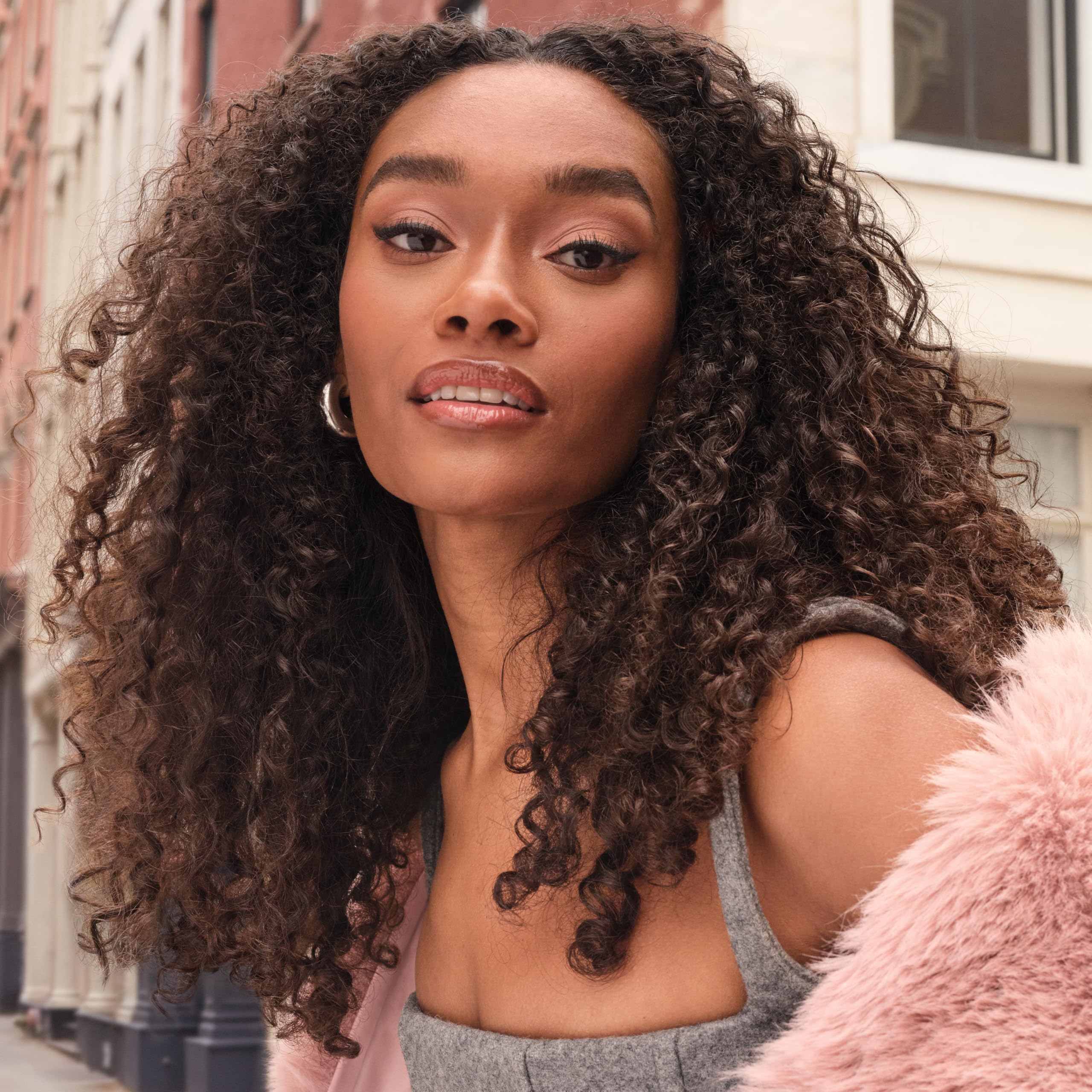 Maybelline Superfluff Brow Mousse packaging display showcases product and shade options.