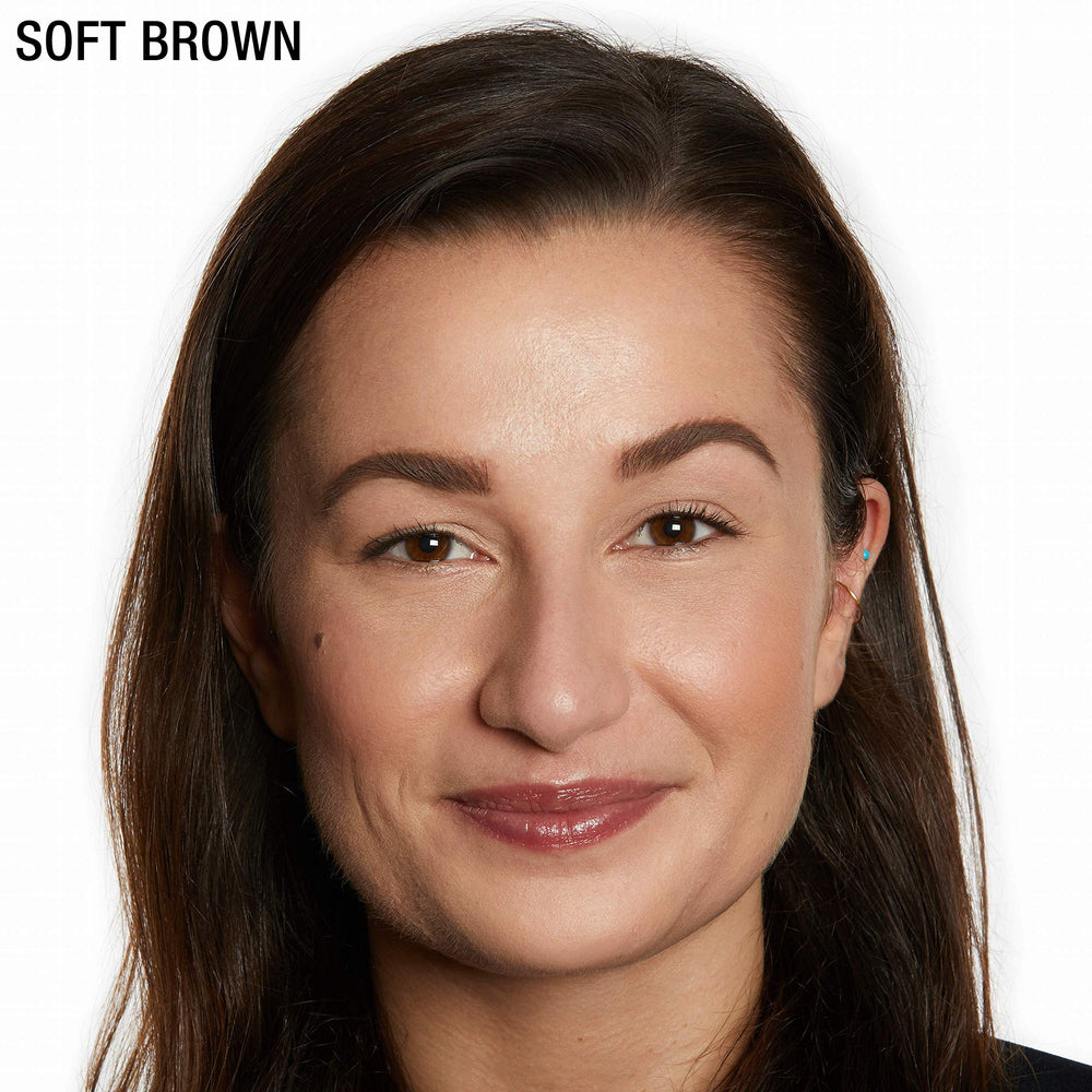 Angled brush and pomade in action for defined, realistic brows.