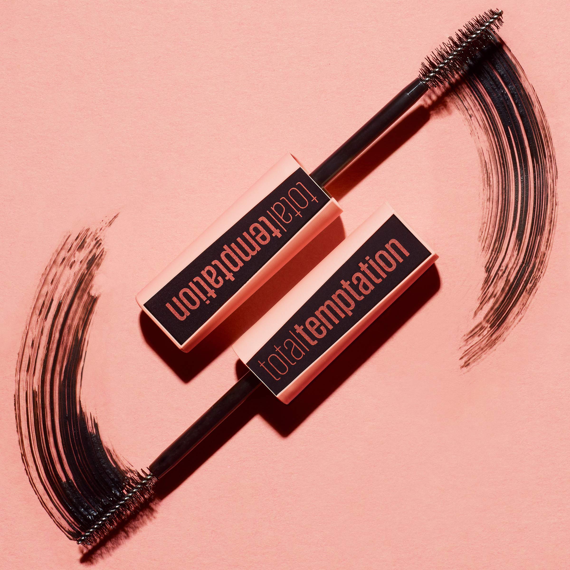 Maybelline Total Temptation mascara applied lashes showing soft, fluffy fullness