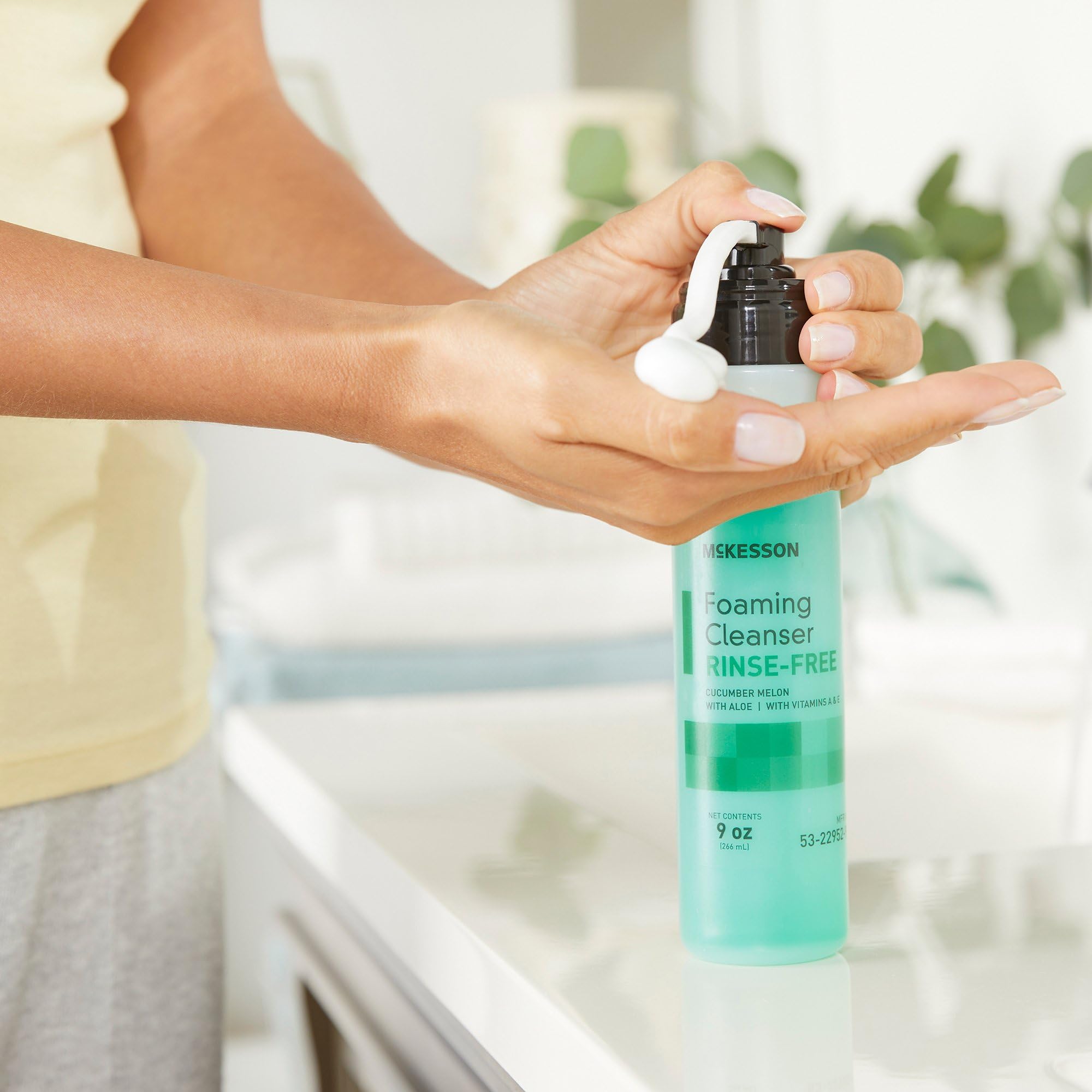 McKesson rinse-free foam cleanser bottle with pump shows easy application and mess-free use.