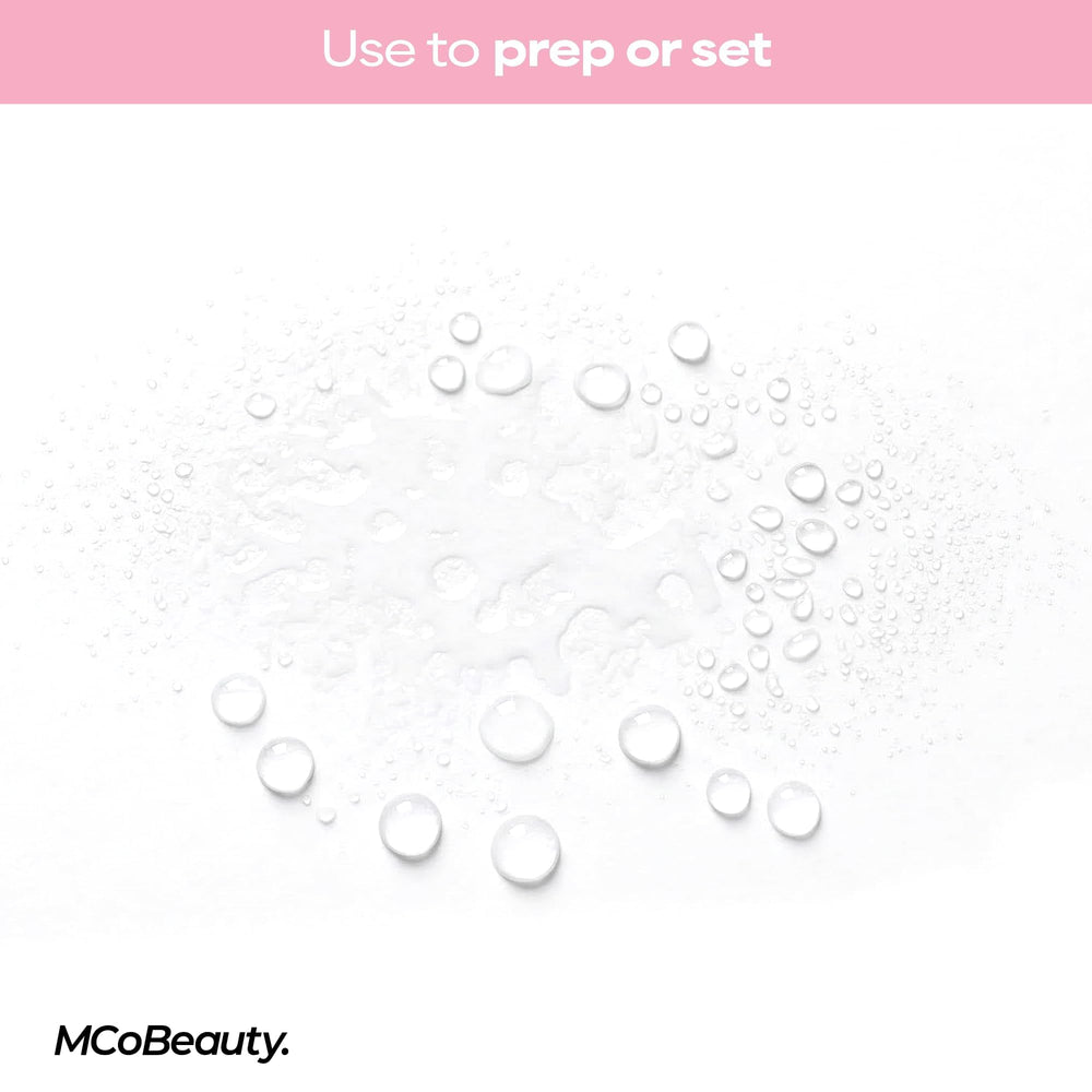 MCoBeauty bottle beside cosmetics flatlay showing routine compatibility benefit: multi-tasking product