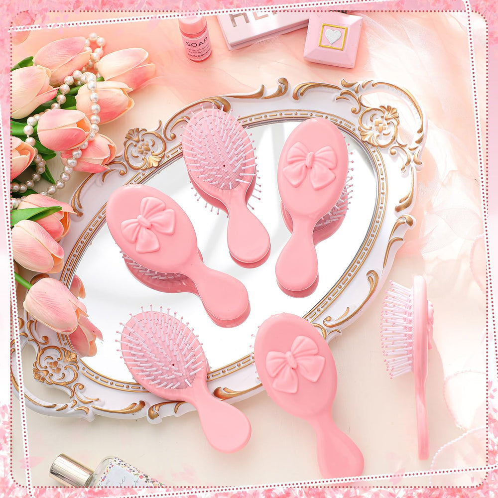 Meanplan pink coquette mini-brush with travel-friendly versatility for all hair types