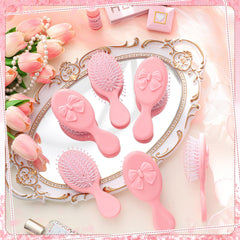 Meanplan pink coquette mini-brush with travel-friendly versatility for all hair types